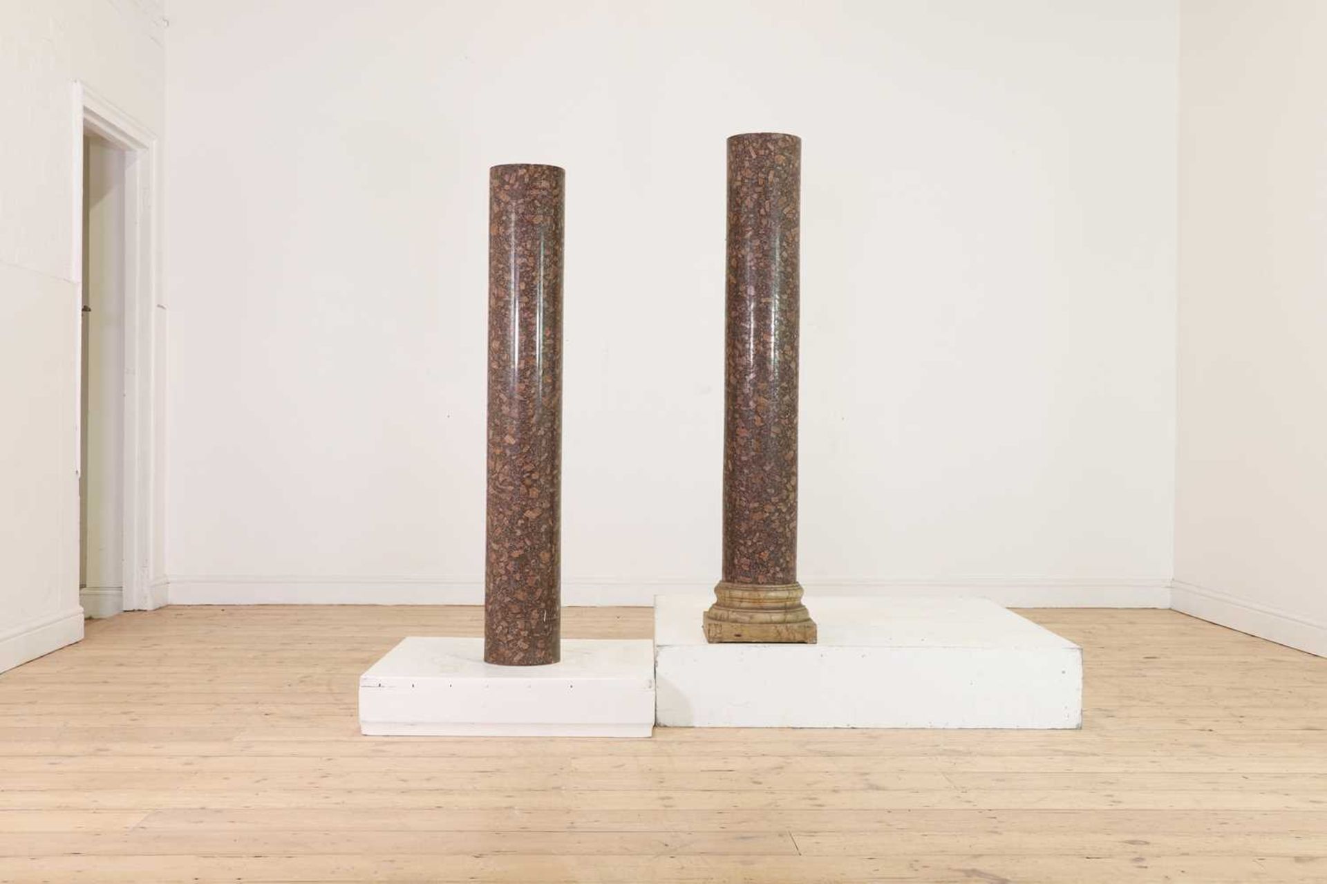 A pair of rouge marble columns,