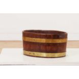 A coopered oak and brass planter or wine cooler,