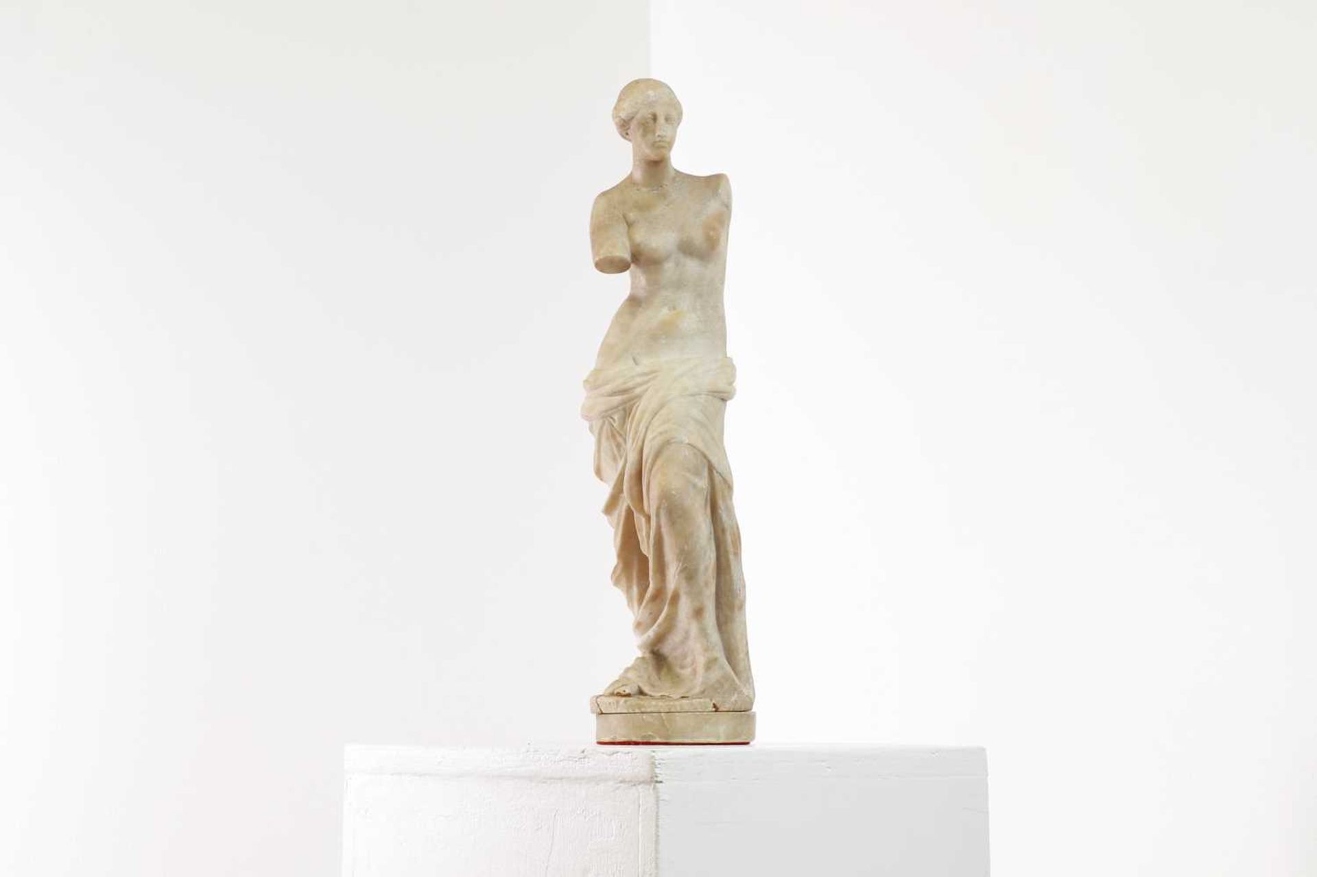 An alabaster figure of the Venus de Milo,