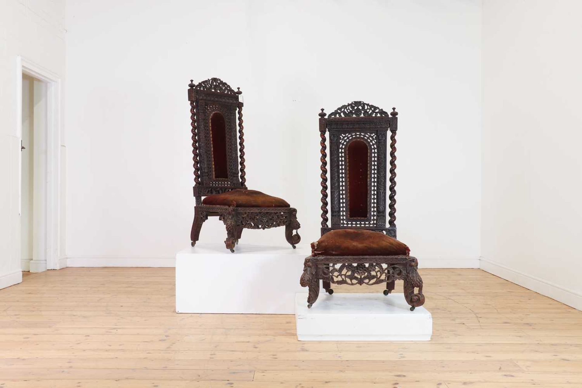 A near pair of carved rosewood occasional chairs,