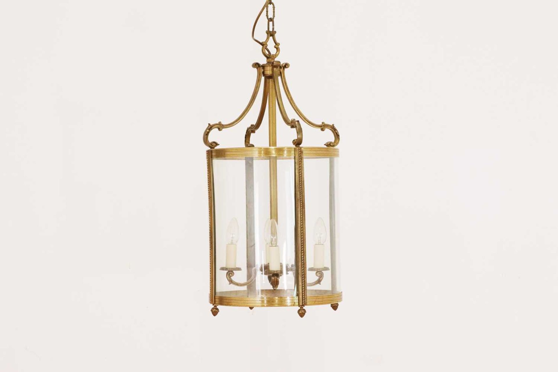 A Louis XVI-style gilt-brass and glass hall lantern