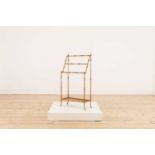 A small gilt-metal towel rail,