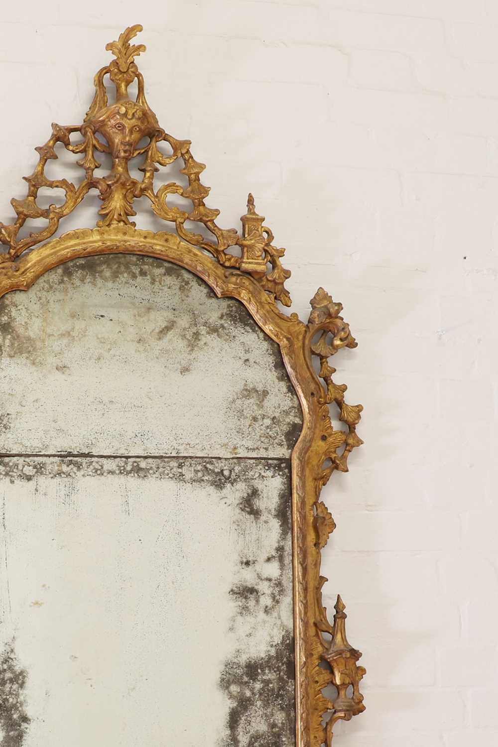 A carved giltwood and gesso pier mirror,