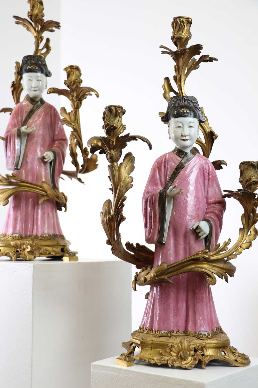 A pair of export famille rose porcelain figures of court officials,