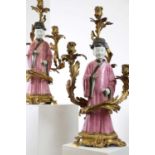 A pair of export famille rose porcelain figures of court officials,