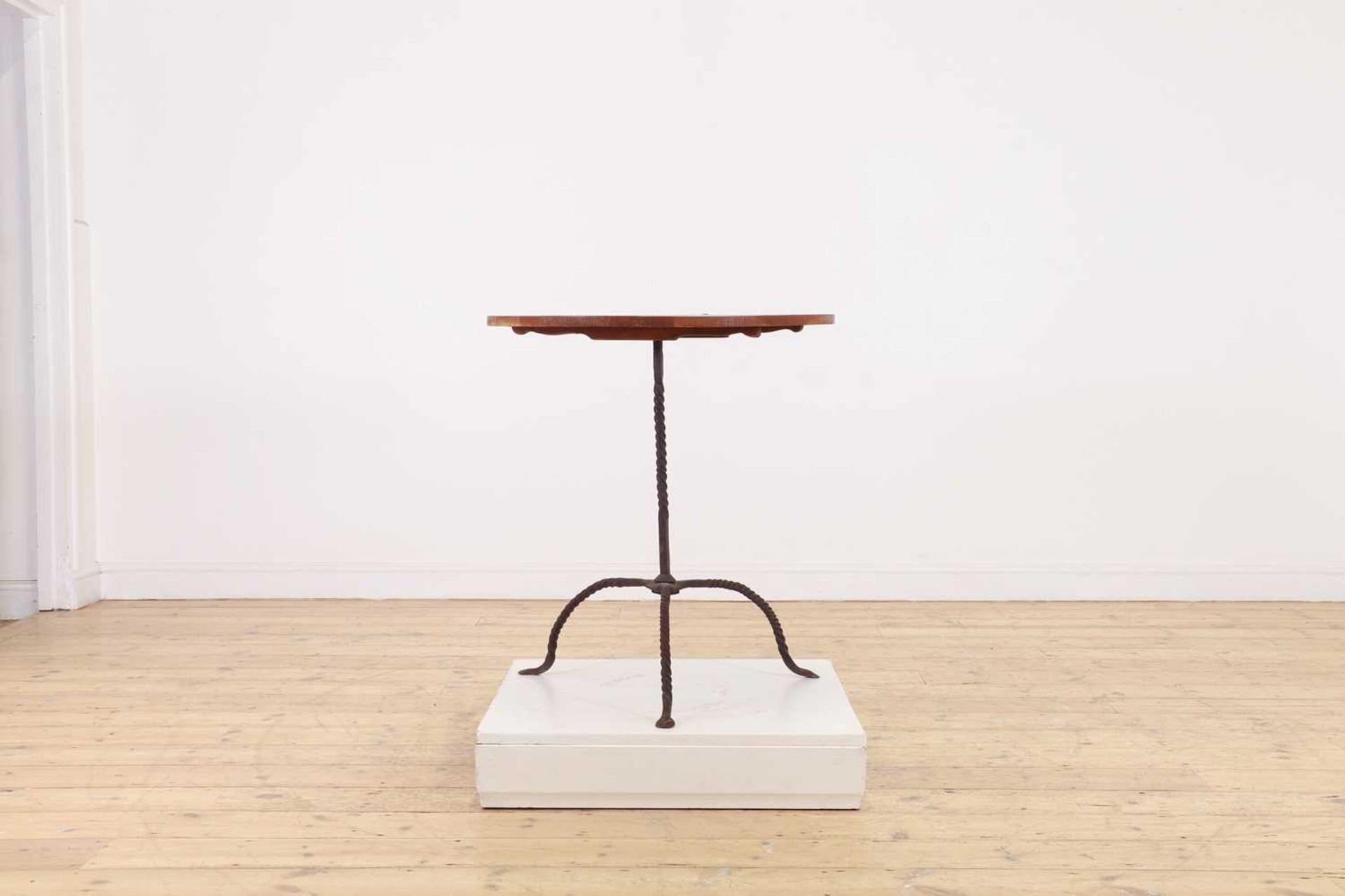 An oak and wrought-iron table,