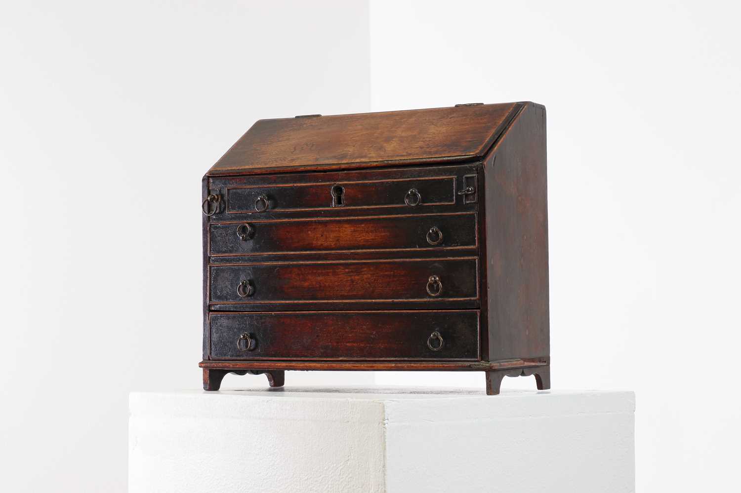 A George III mahogany miniature bureau,