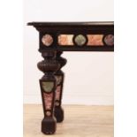 An ebonised, specimen and parcel-gilt console table,