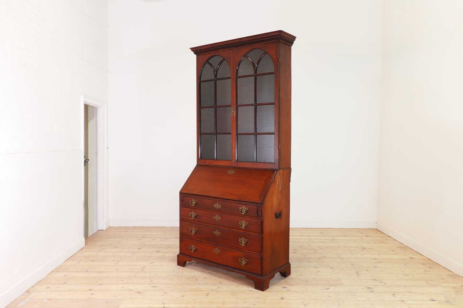 A George III colonial teak bureau bookcase