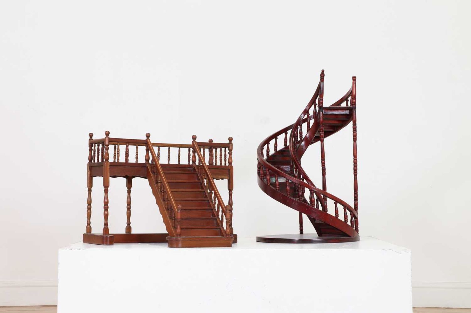 Two wooden architectural models of staircases,