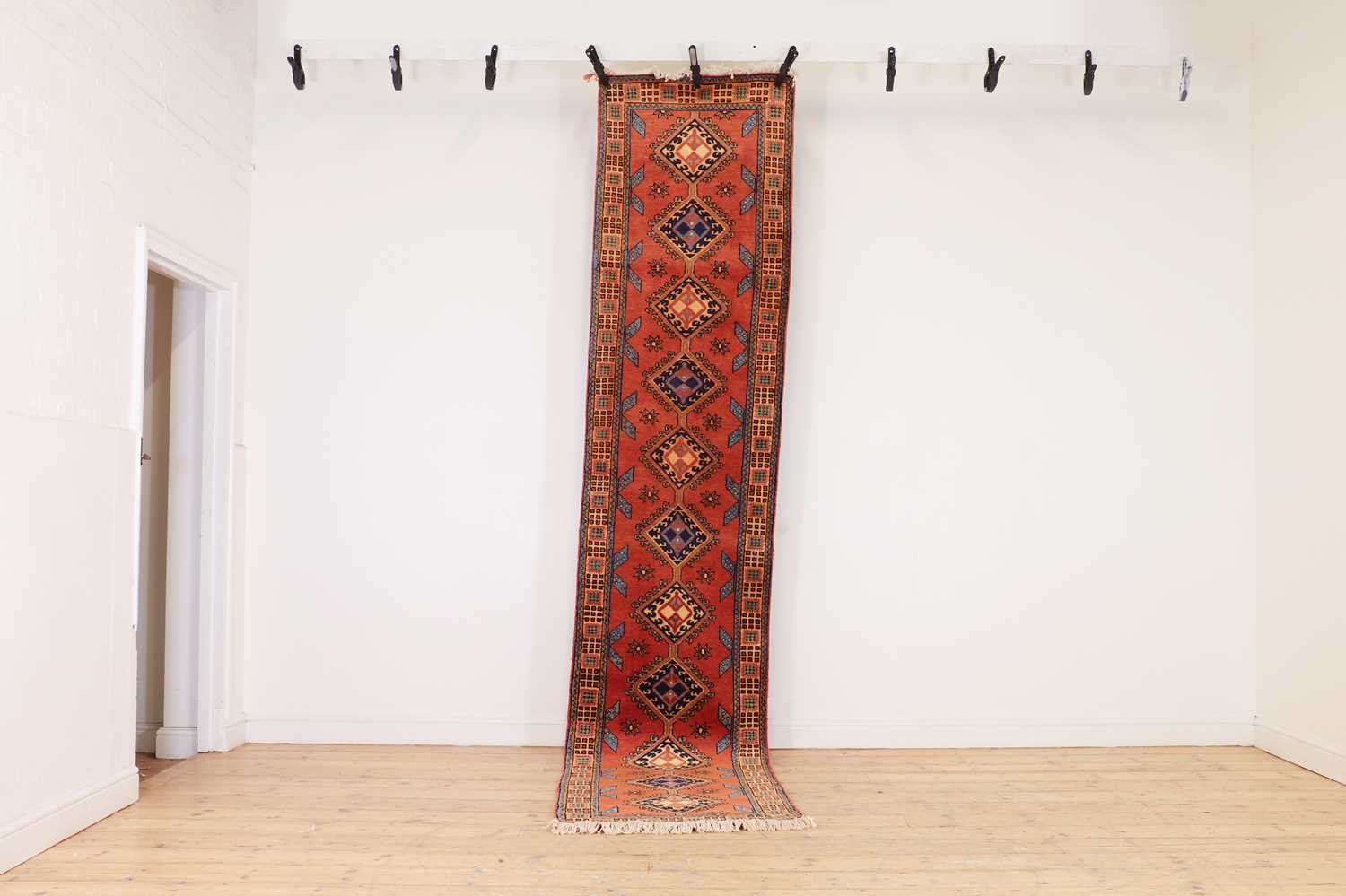 A narrow wool runner,