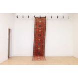 A narrow wool runner,