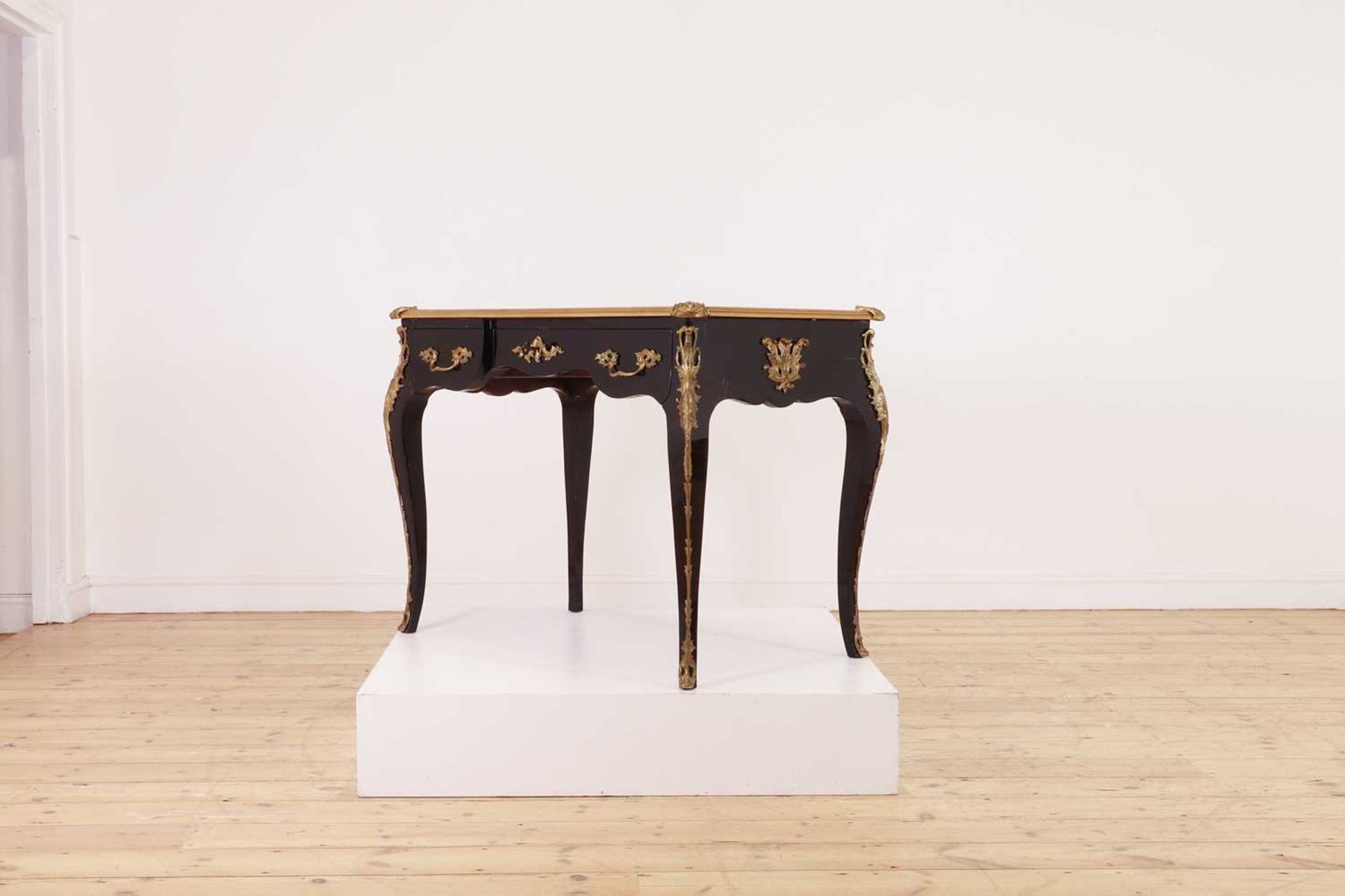 A Louis XV-style ebonised bureau plat,