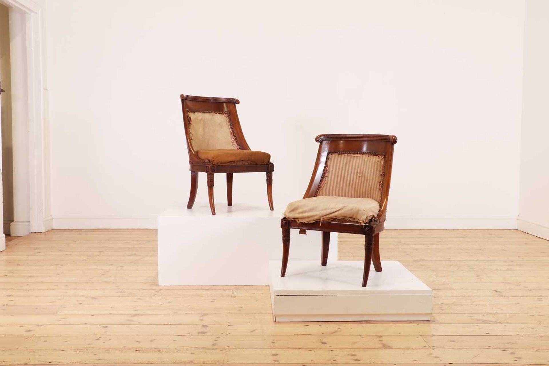 A pair of Charles X mahogany low chairs,