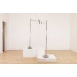 A pair of adjustable chrome floor lamps,