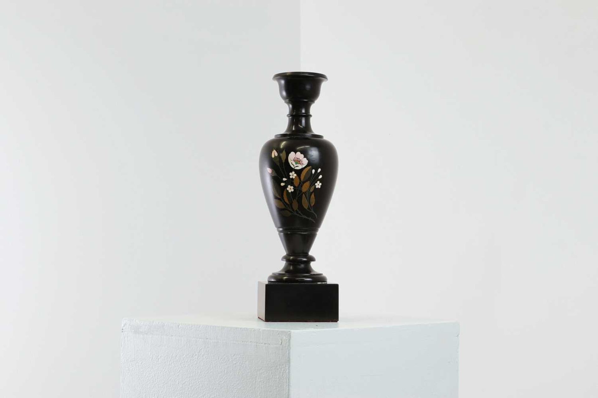 An Ashford black marble pedestal vase,