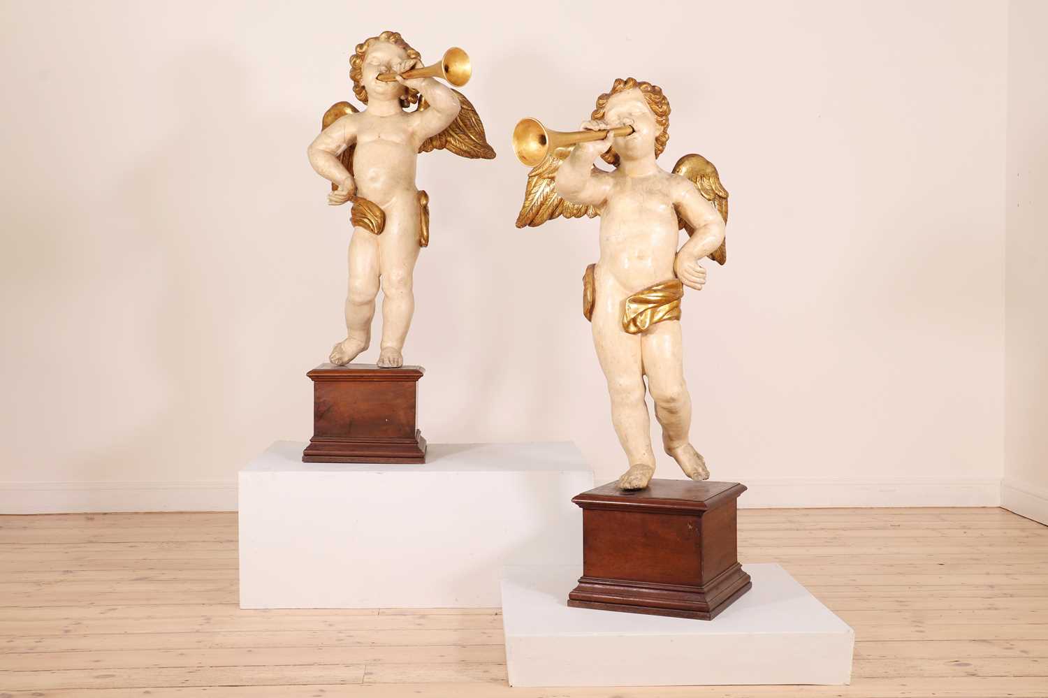 A pair of painted and parcel-gilt wooden putti, - Image 2 of 23