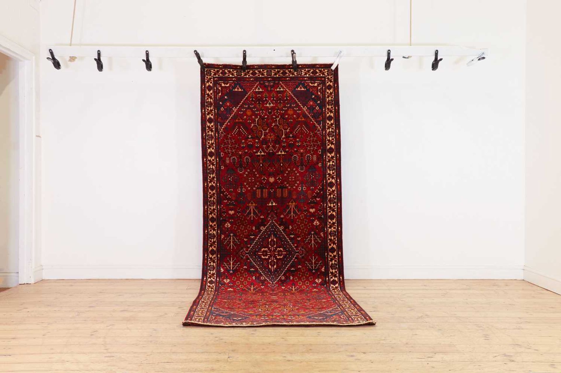 A Persian wool runner,