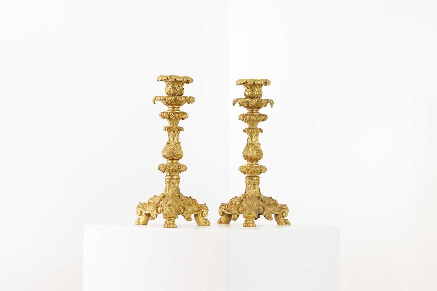 A pair of gilt-bronze candlesticks,