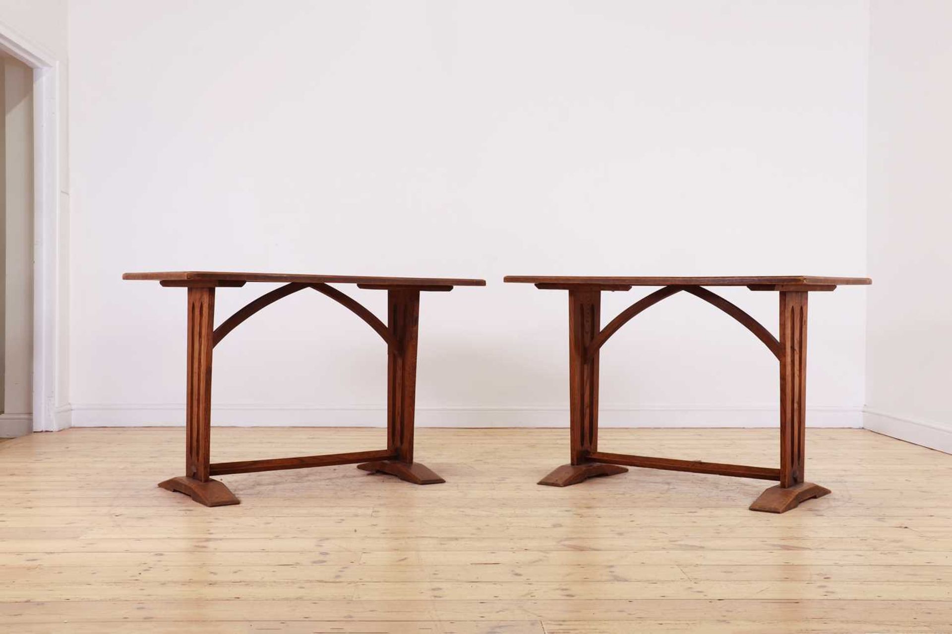 A pair of Arts and Crafts oak tables