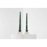 A pair of white marble and malachite obelisks