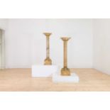 A pair of giallo antico marble pedestals,