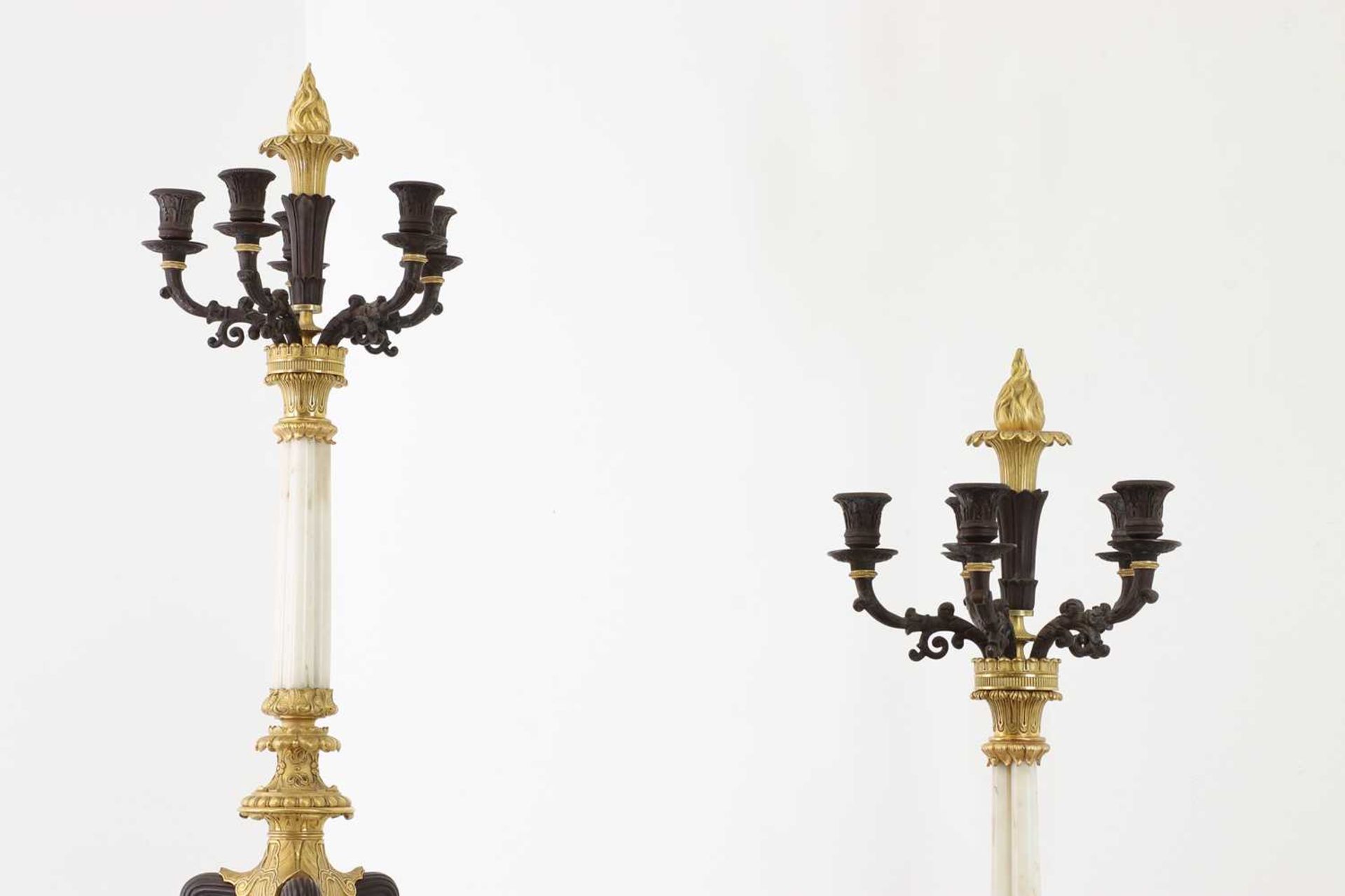A pair of Regency-style bronze and parcel-gilt candelabra,