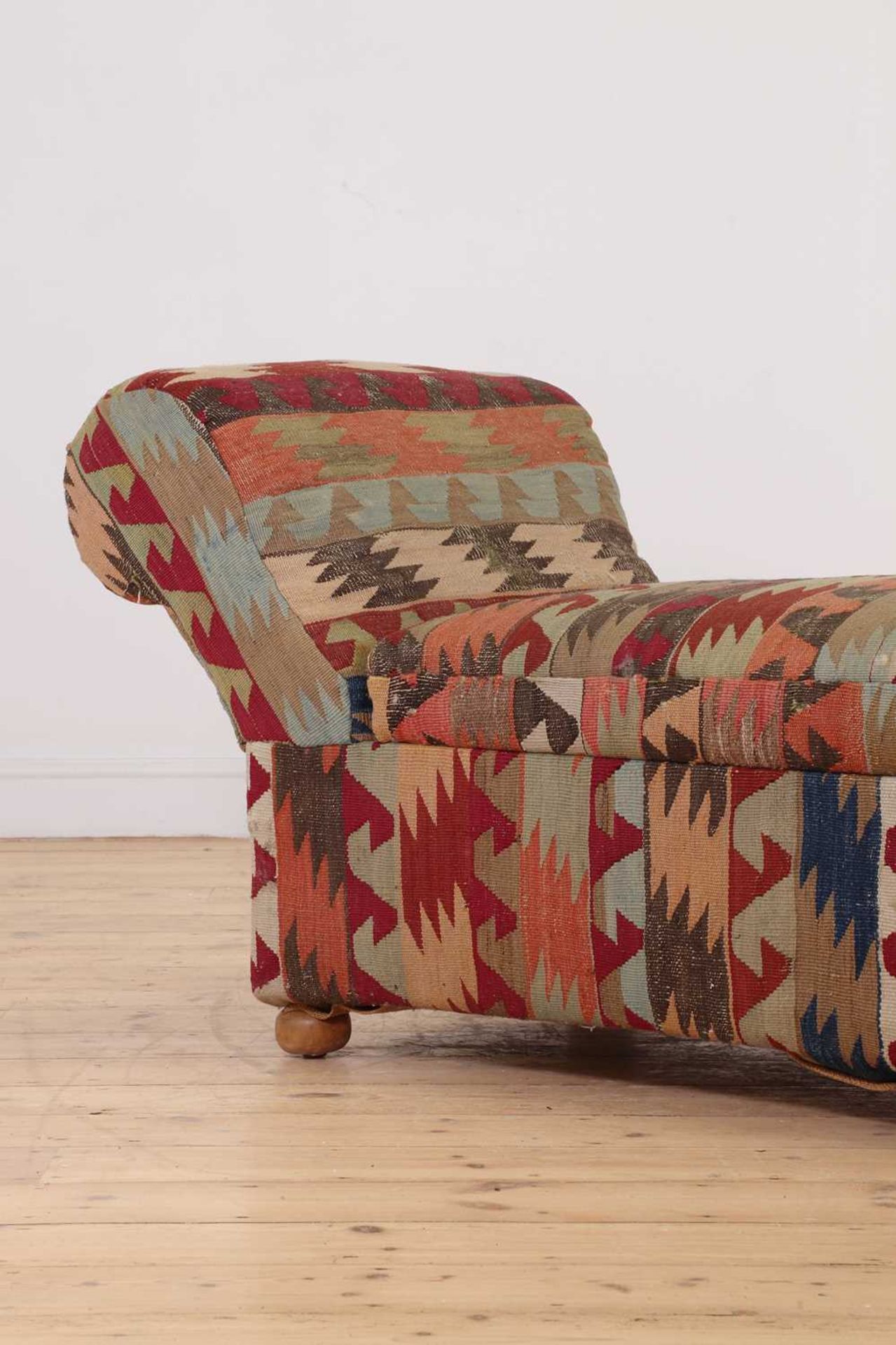 A kilim-upholstered Ottoman daybed