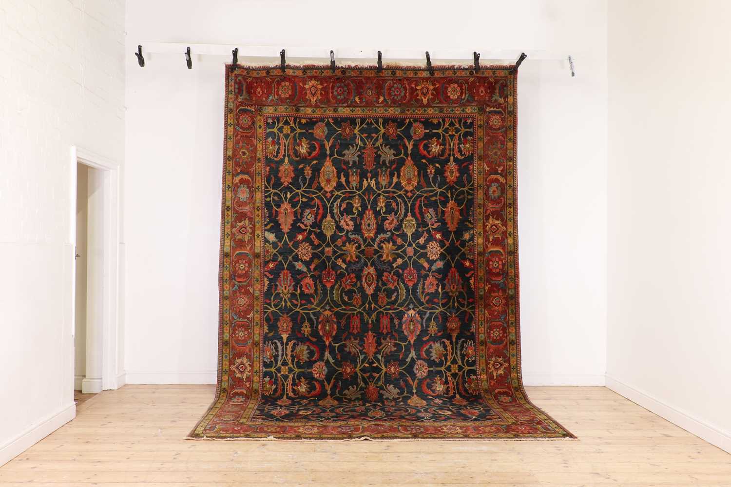 A Persian-style wool carpet,