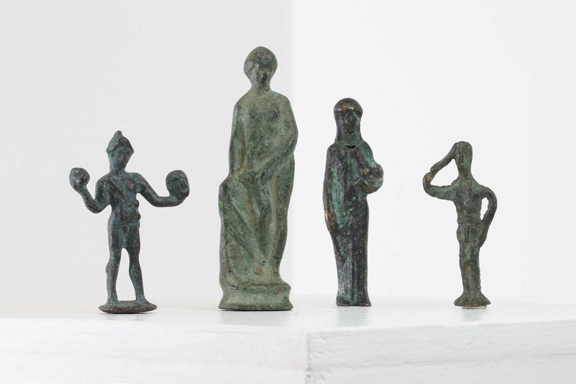 A group of small grand tour bronze figures after the antique,