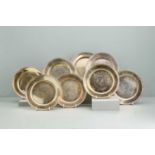 A set of eight sterling gilt side plates,