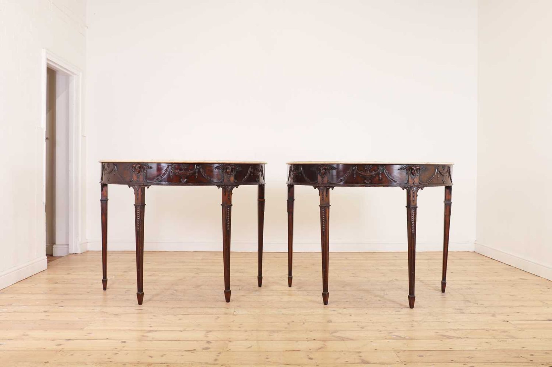 A pair of George III-style mahogany pier tables in the manner of Robert Adam,