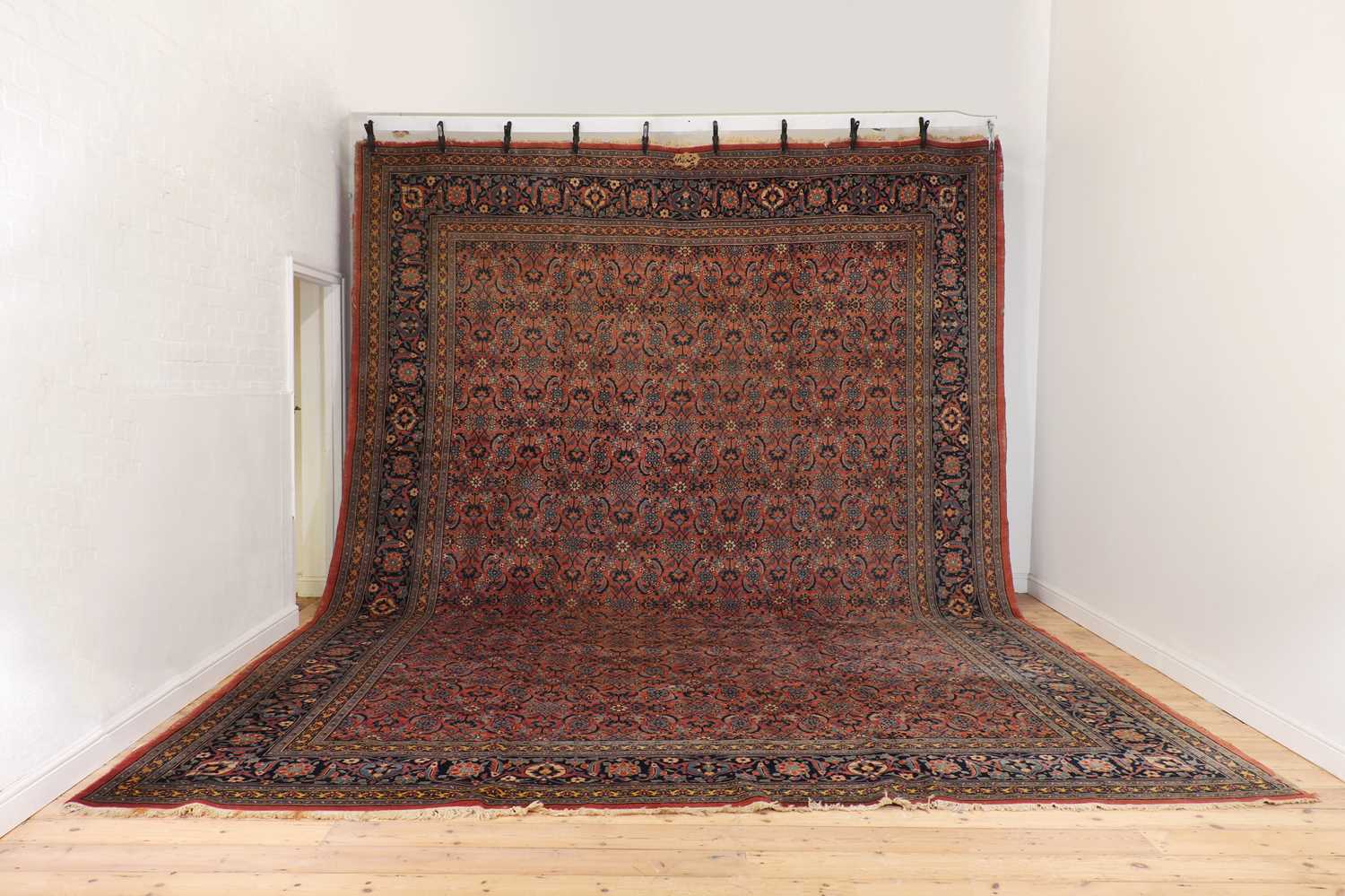 A large wool Persian carpet,