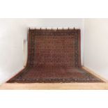 A large wool Persian carpet,