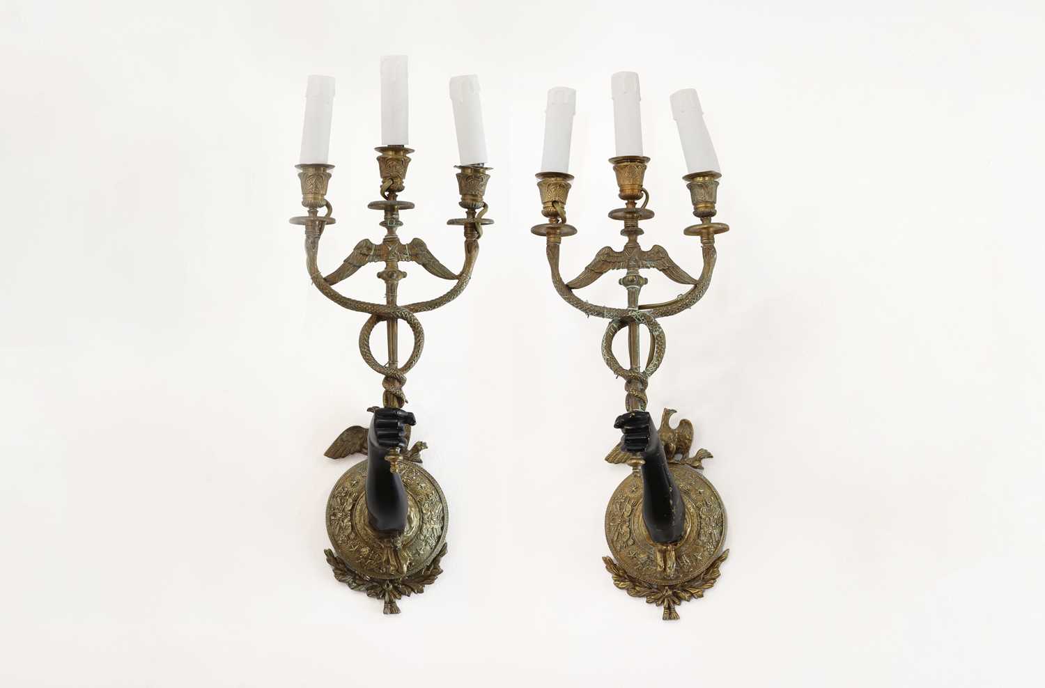 A pair of Empire-style gilt and lacquered-brass wall lights