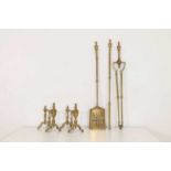 A set of brass fire tools,