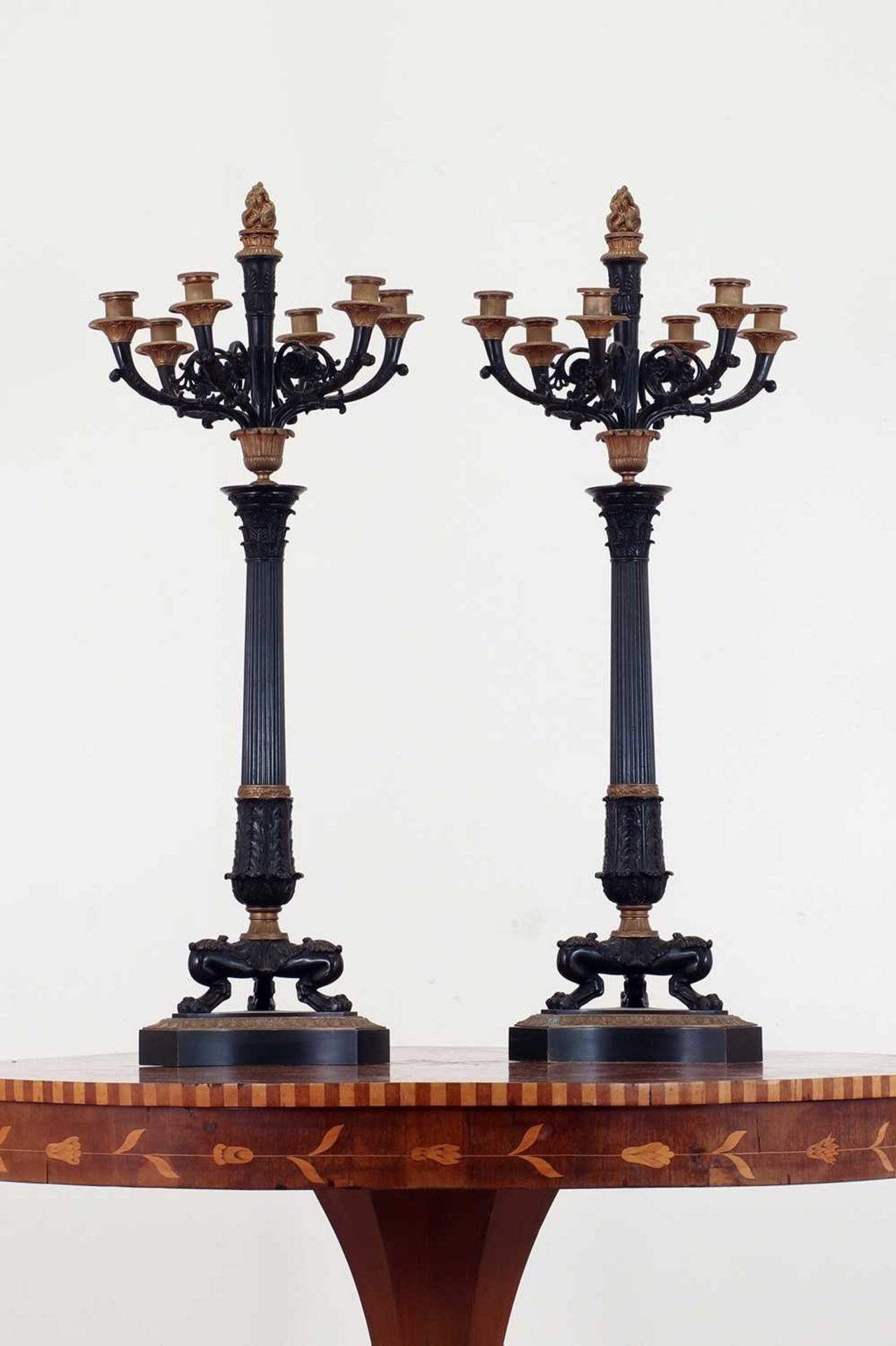 A pair of large gilt and patinated bronze candelabra,