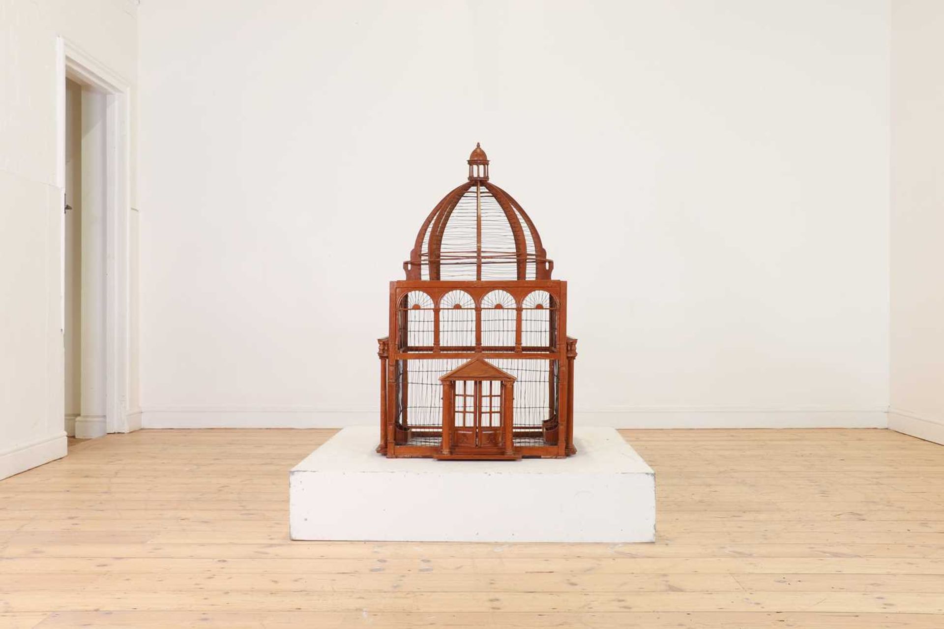 A large-scale hardwood birdcage,