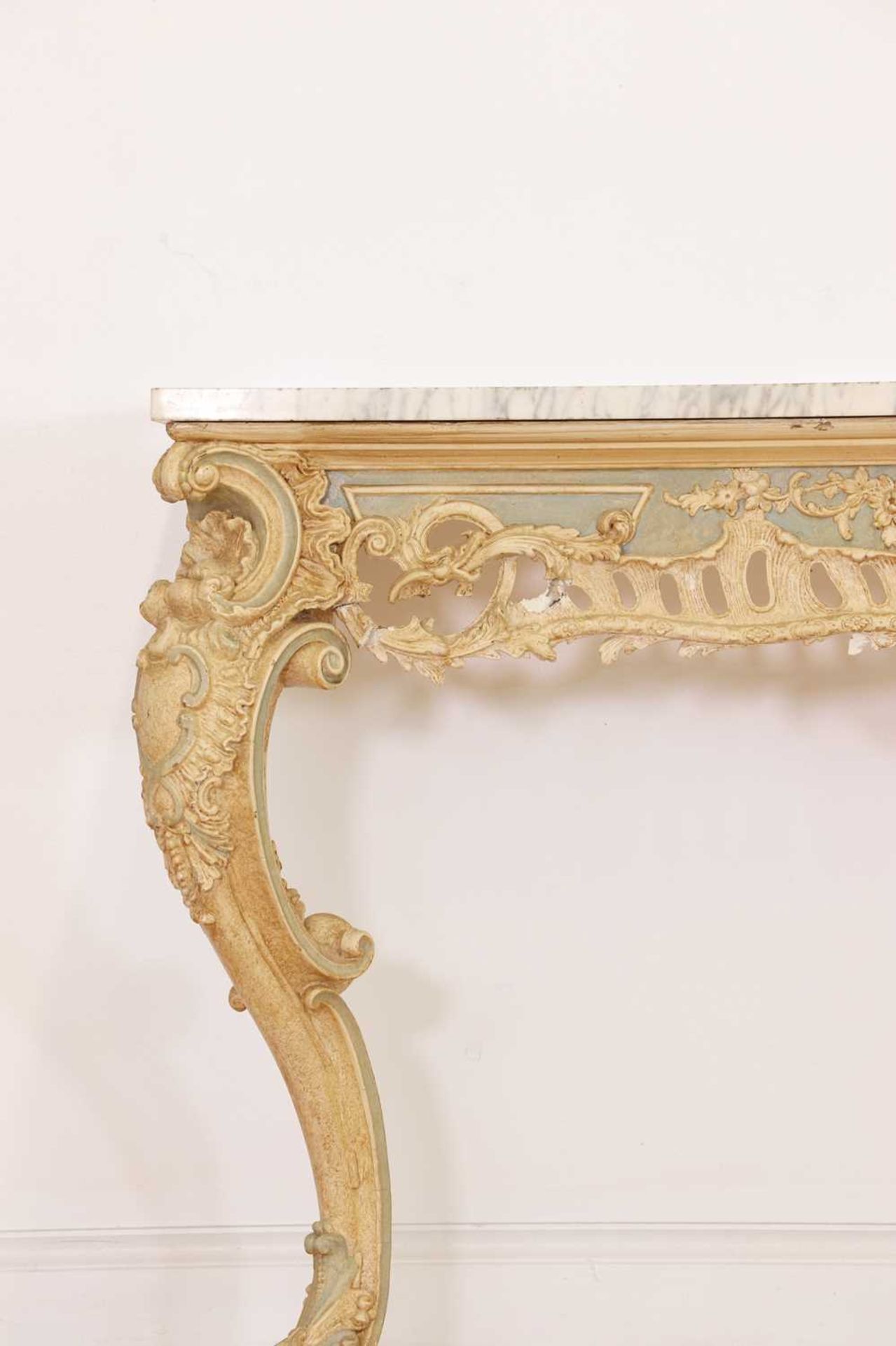 A carved and painted pine console table,