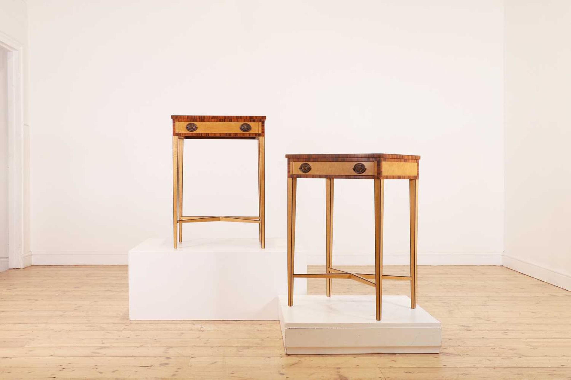 A pair of George III-style satinwood and coromandel side tables,