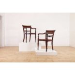A set of eight hardwood dining chairs,
