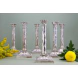A composed set of six Edwardian silver candlesticks