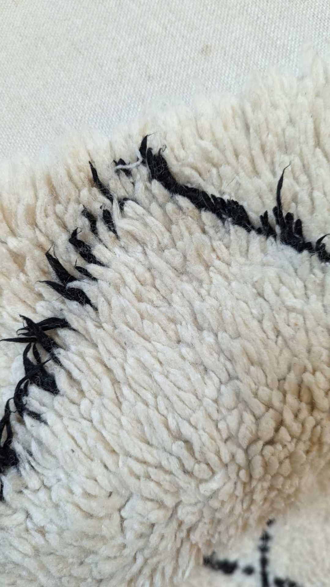 A wool Berber or Beni Ourain rug, - Bild 8 aus 17