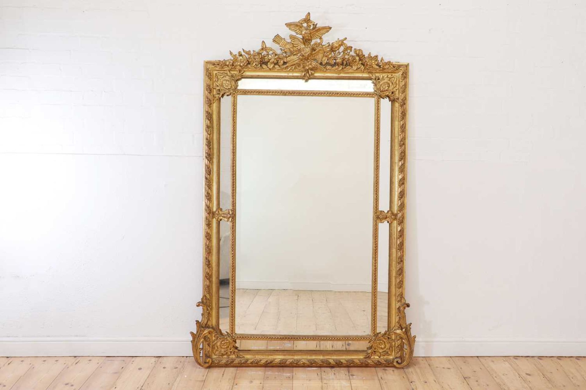 A Louis XVI-style giltwood and gesso overmantel mirror,