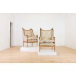 A pair of French giltwood bergère armchairs,