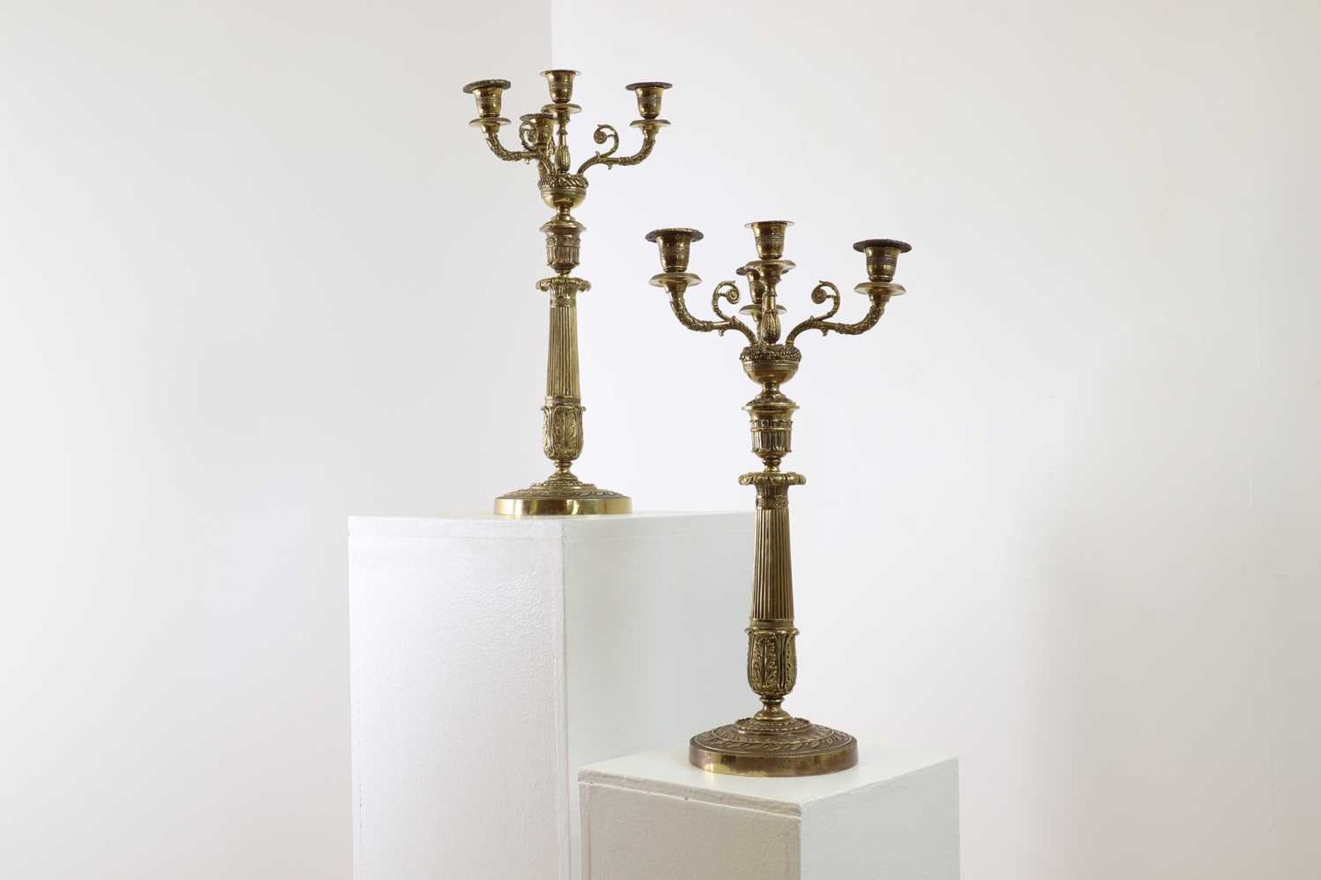 A pair of gilt-metal Empire-style candelabra,