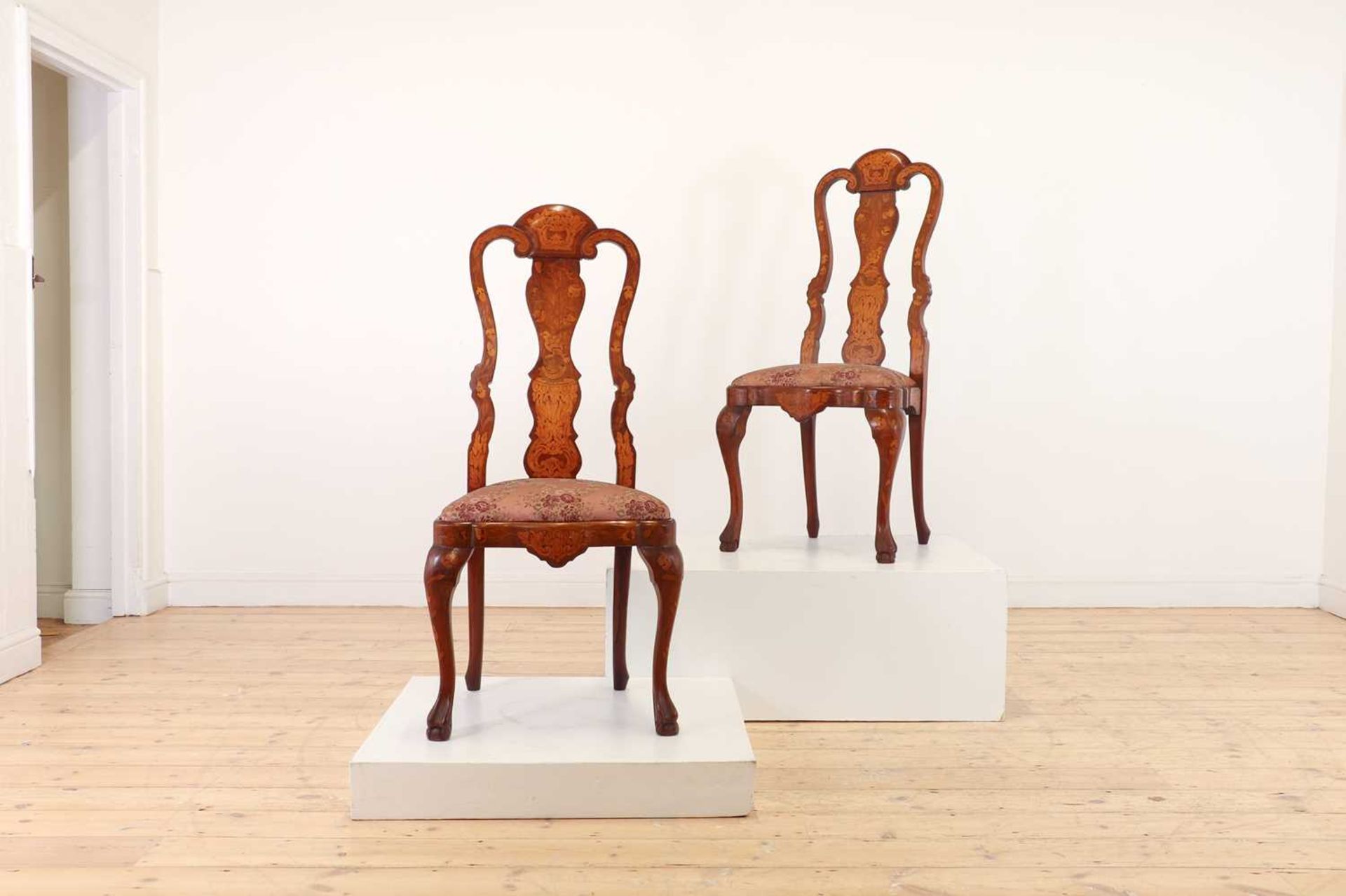 A pair of walnut and marquetry side chairs,