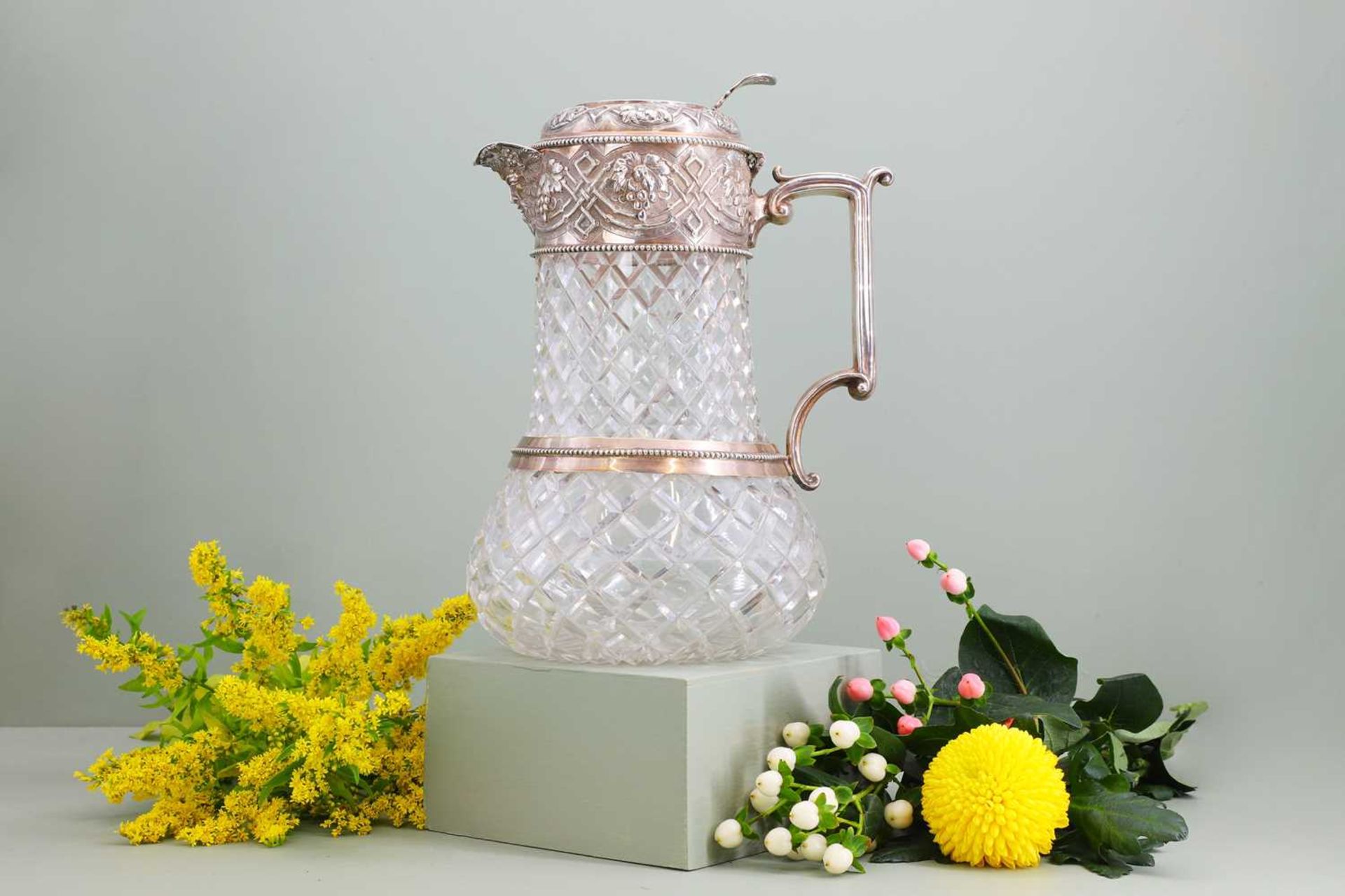 A silver-mounted cut-glass lemonade or water jug,