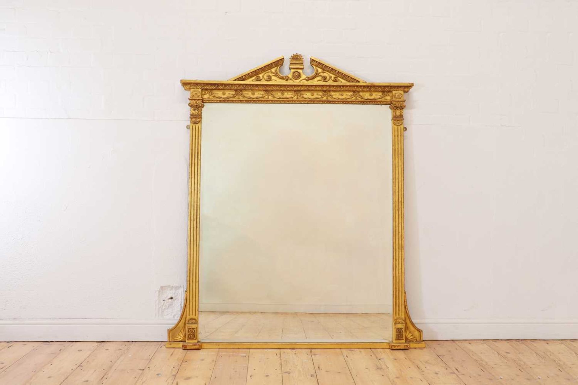 A George III-style carved giltwood and gesso overmantel mirror,