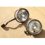 A pair of 'Tarrida' vintage car headlamps,